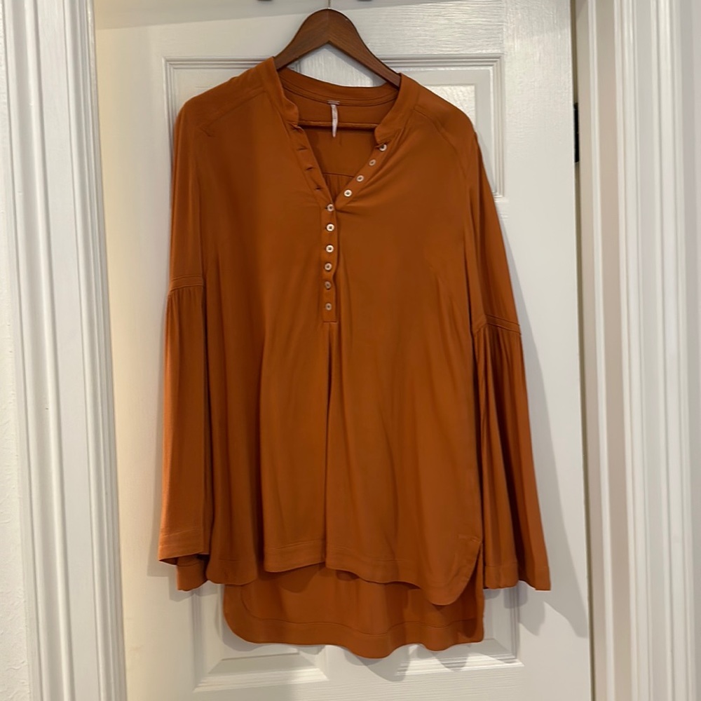 Free people bell sleeve orange blouse. Size small.